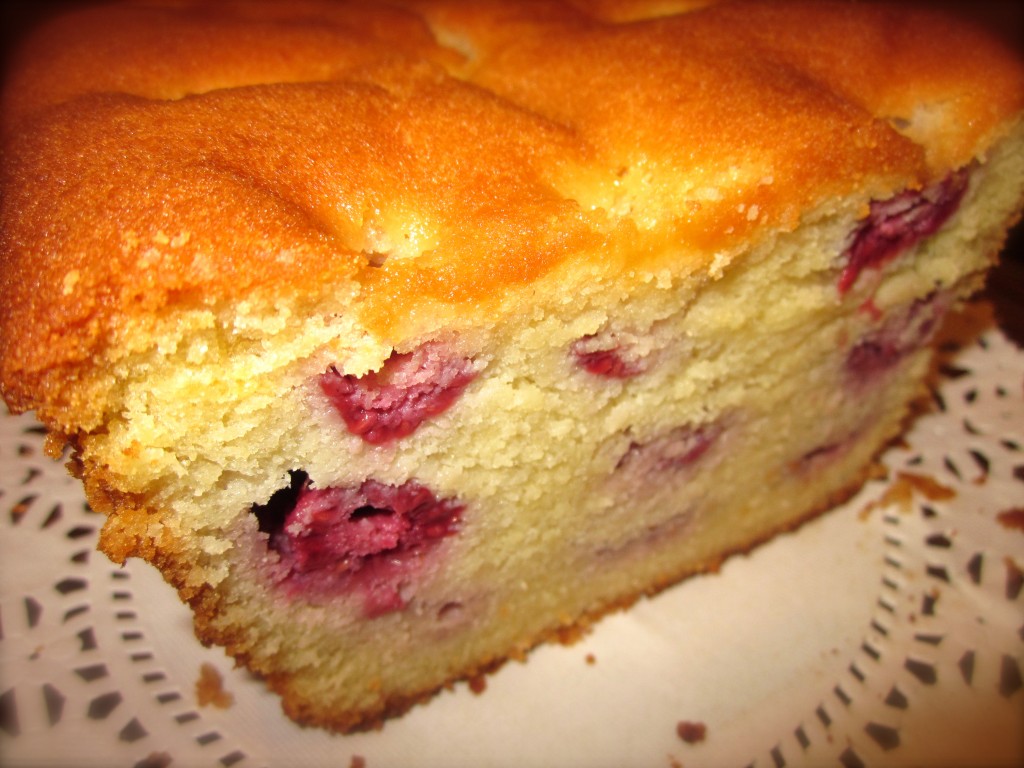 The cake is loaded with strategically placed moist, plump raspberries.